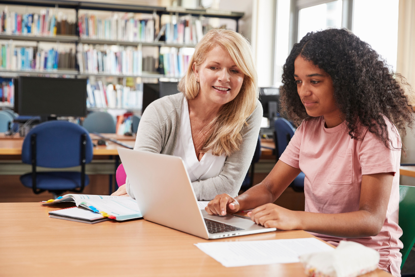 Student Talking to a Teacher About GCSE Remark