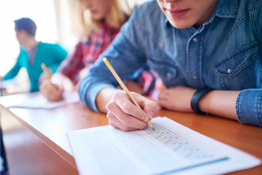 Understanding UCAS Points - Student Writing an A-level Exam