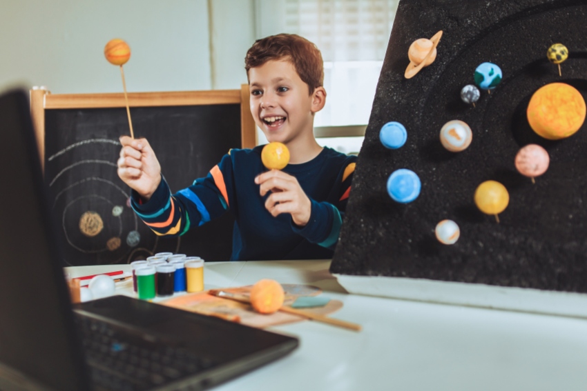 Child Learning About Planets