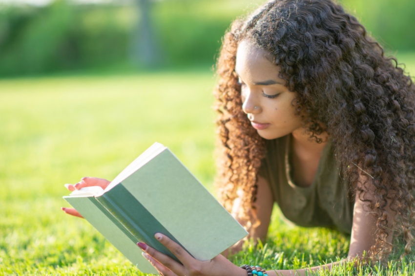A Teenager Reading a YA Book