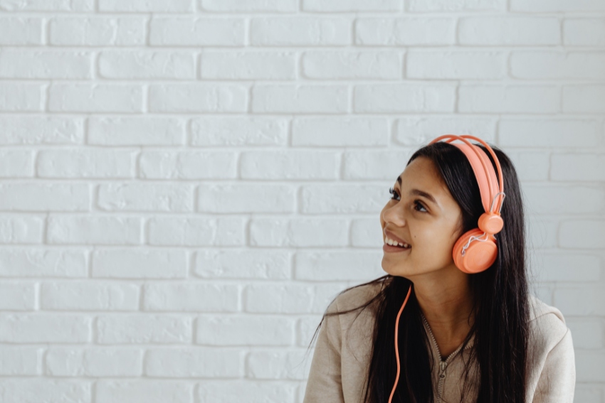 Girl Listening to Music Whilst Studying