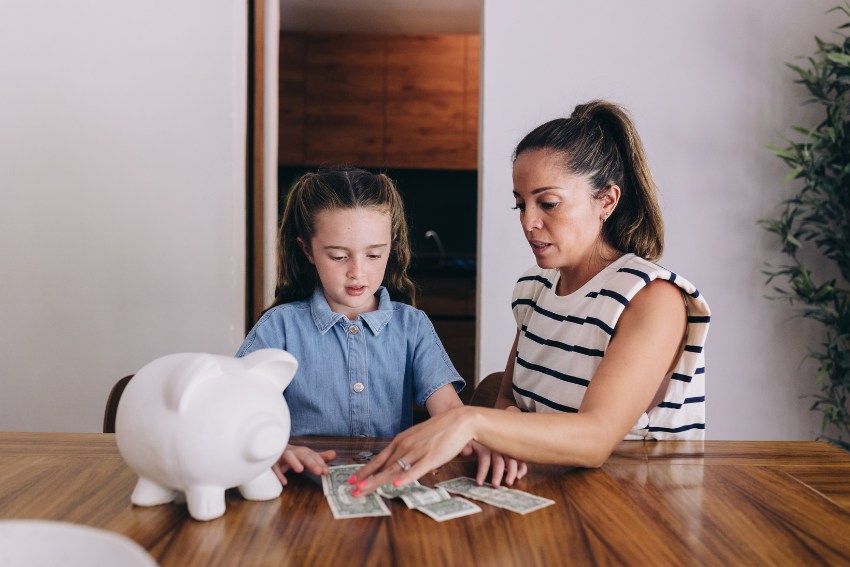 Mother and Daughter Counting Their Savings