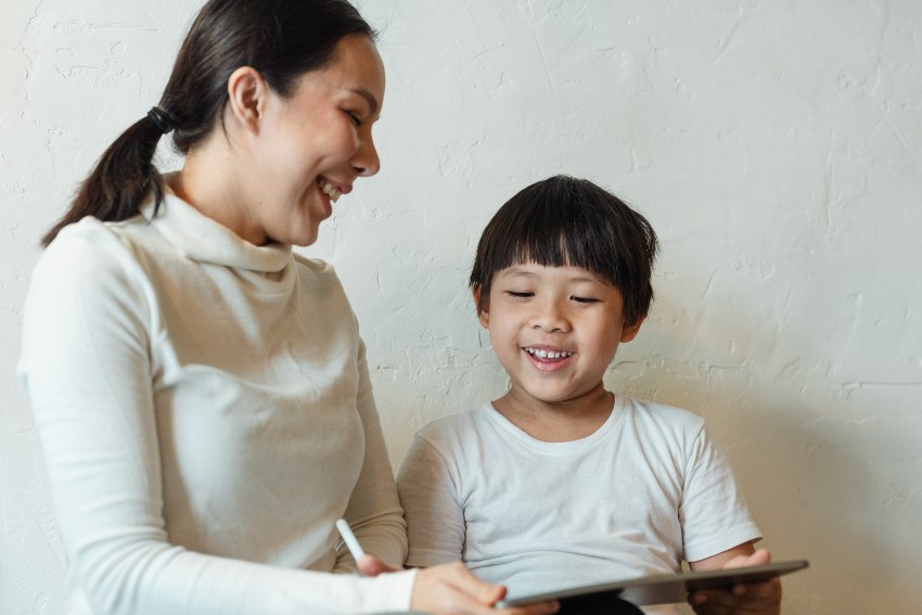 Mother Teaches Child Relaxation Exercise