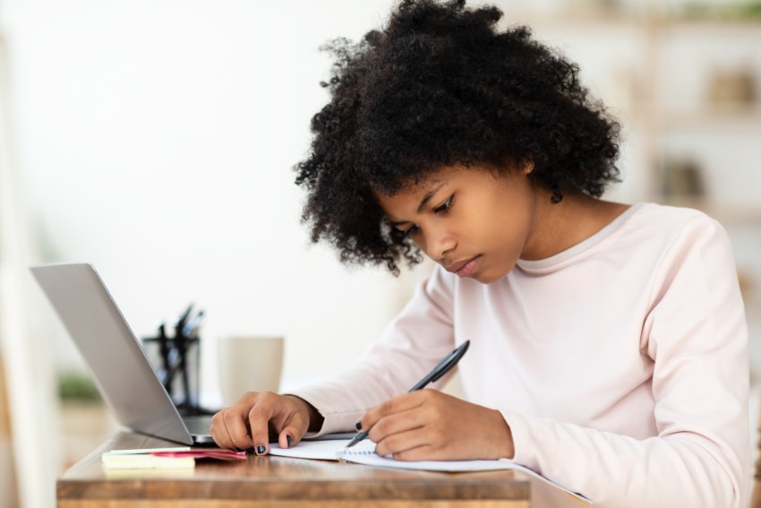 Girl Writing IB Essey With ChatGPT